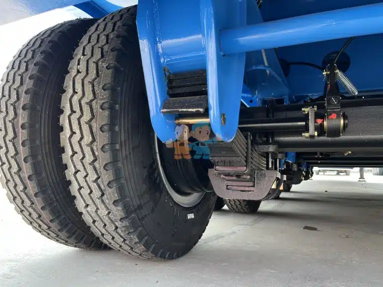 Low bed trailer axle and suspension system