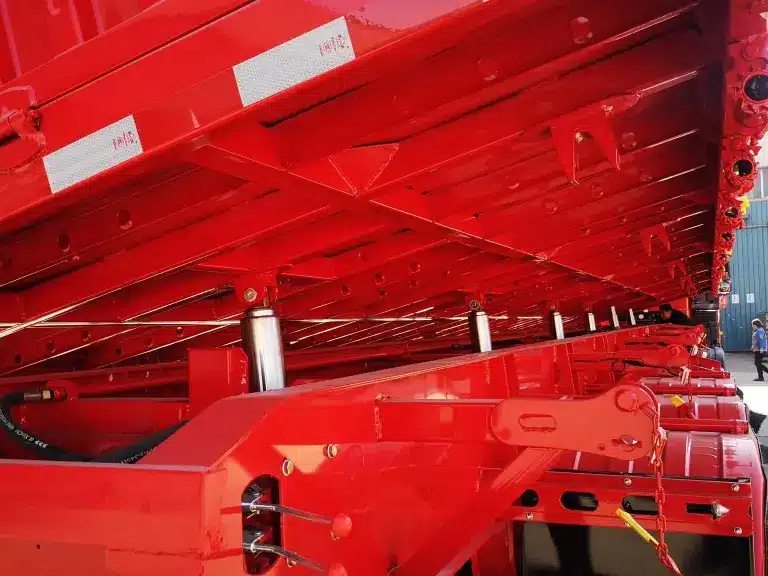 Système hydraulique des remorques à bascule latérale